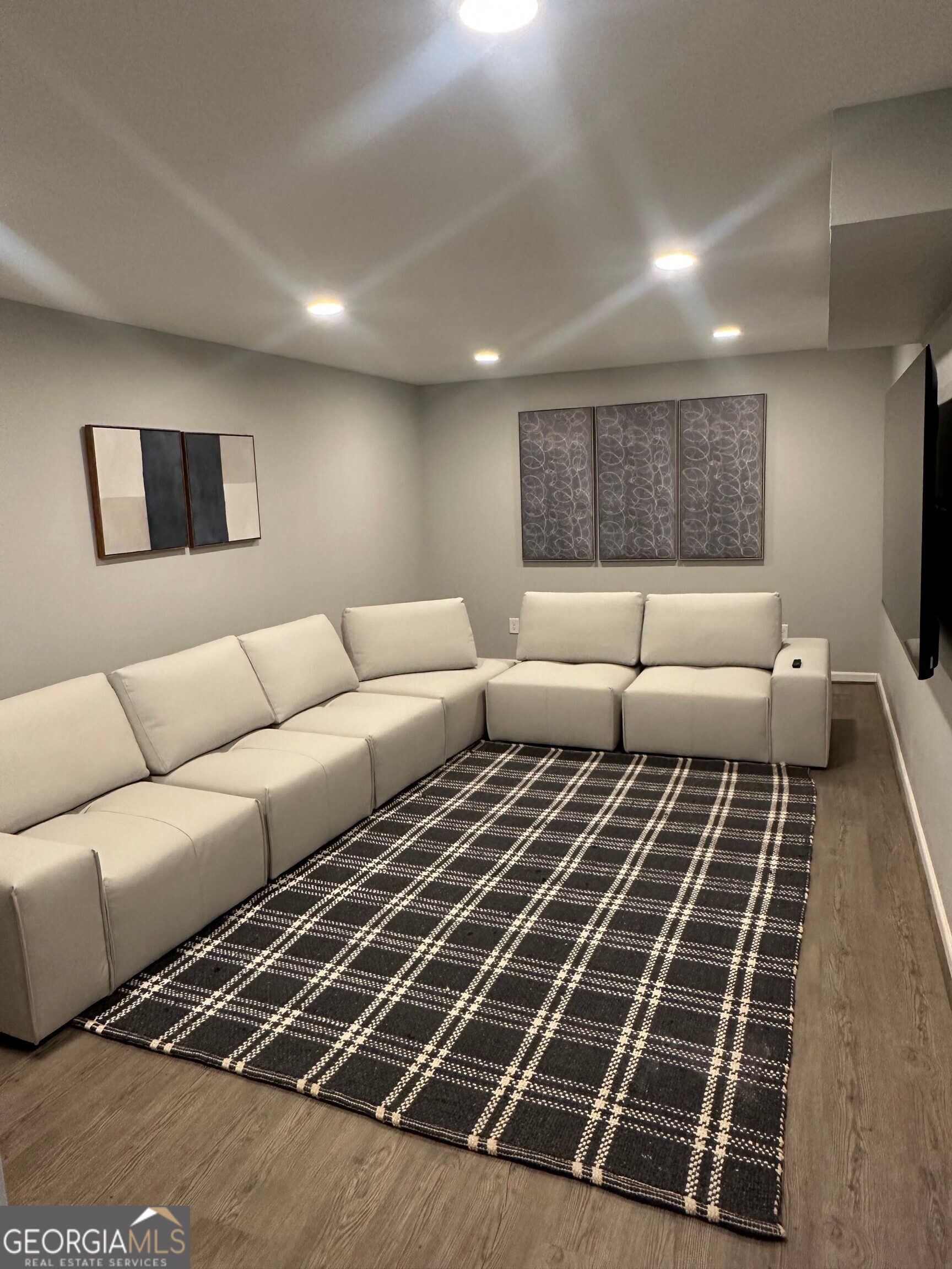 175 Thompson Place Gainesville, GA 30506 - Photo 20 of 32 a living room with furniture a rug and a rug