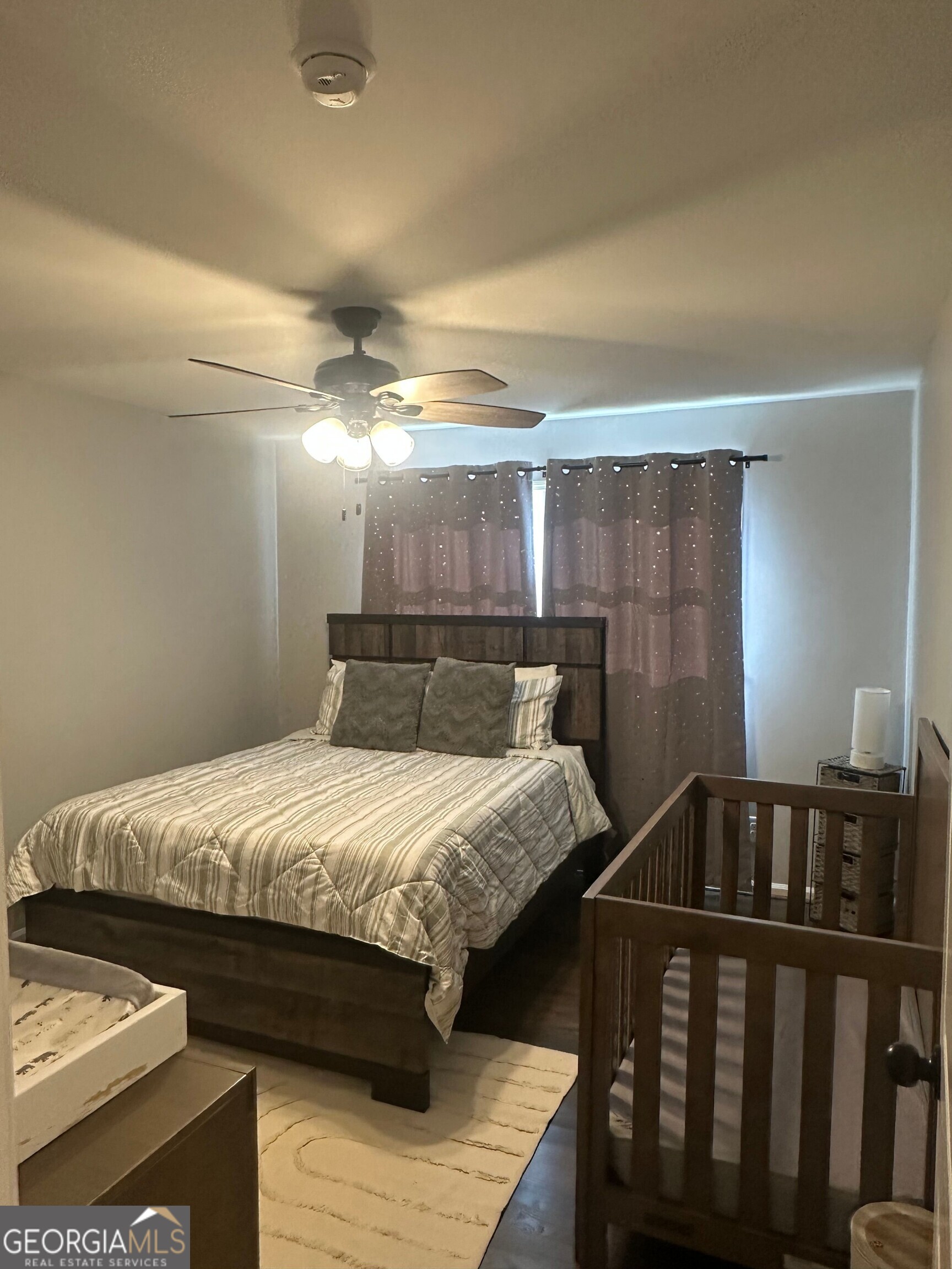 175 Thompson Place Gainesville, GA 30506 - Photo 9 of 32 a bedroom with a bed and window