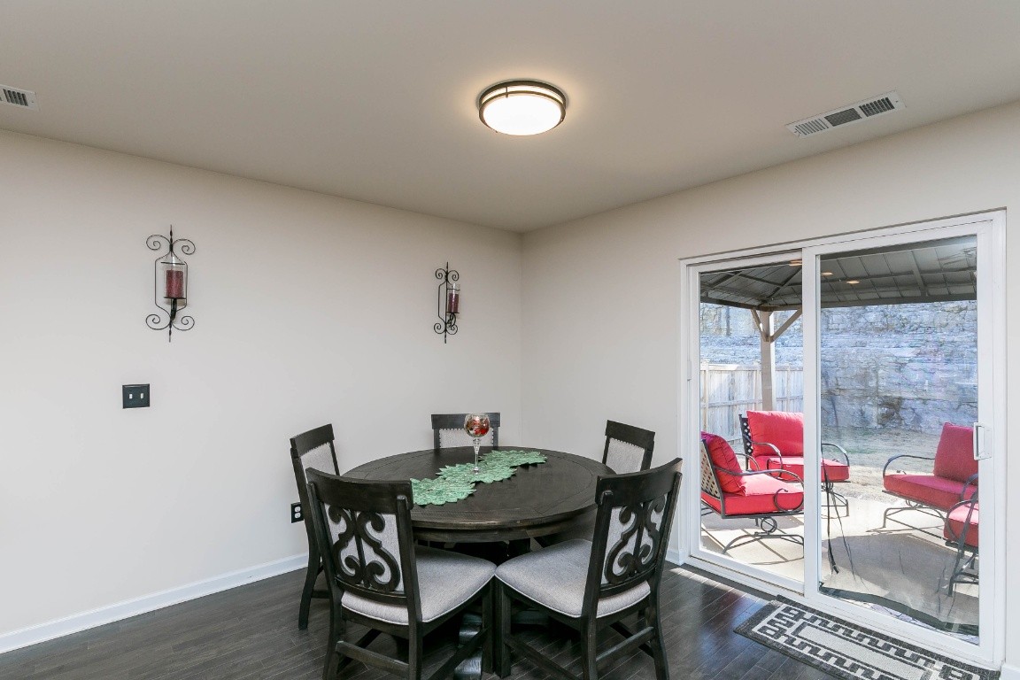 1450 Old Stone Road Lebanon, TN 37087 - Photo 9 of 24 a view of a dining room with furniture and wooden floor