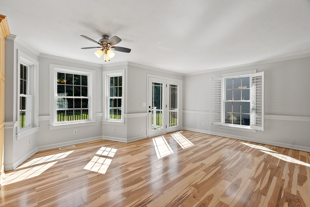 18 Sycamore Road Shrewsbury, MA 01545 - Photo 13 of 40 a view of empty room with wooden floor and fan