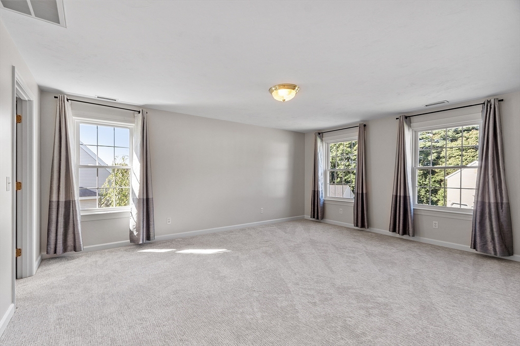 18 Sycamore Road Shrewsbury, MA 01545 - Photo 19 of 40 an empty room with windows and closet