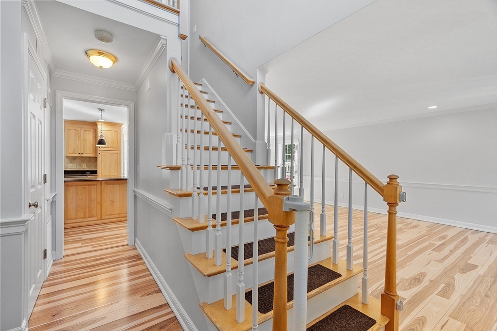18 Sycamore Road Shrewsbury, MA 01545 - Photo 2 of 40 a view of staircase with wooden floor and white walls