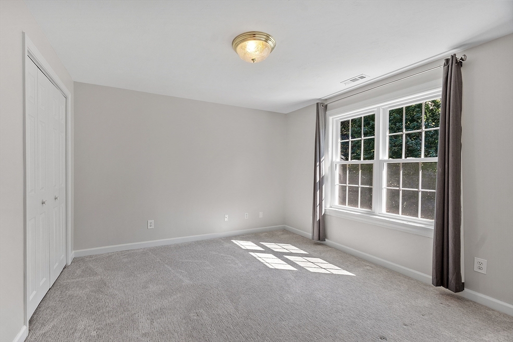 18 Sycamore Road Shrewsbury, MA 01545 - Photo 25 of 40 a view of empty room with windows