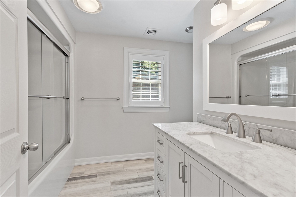18 Sycamore Road Shrewsbury, MA 01545 - Photo 26 of 40 a bathroom with a granite countertop sink mirror and double