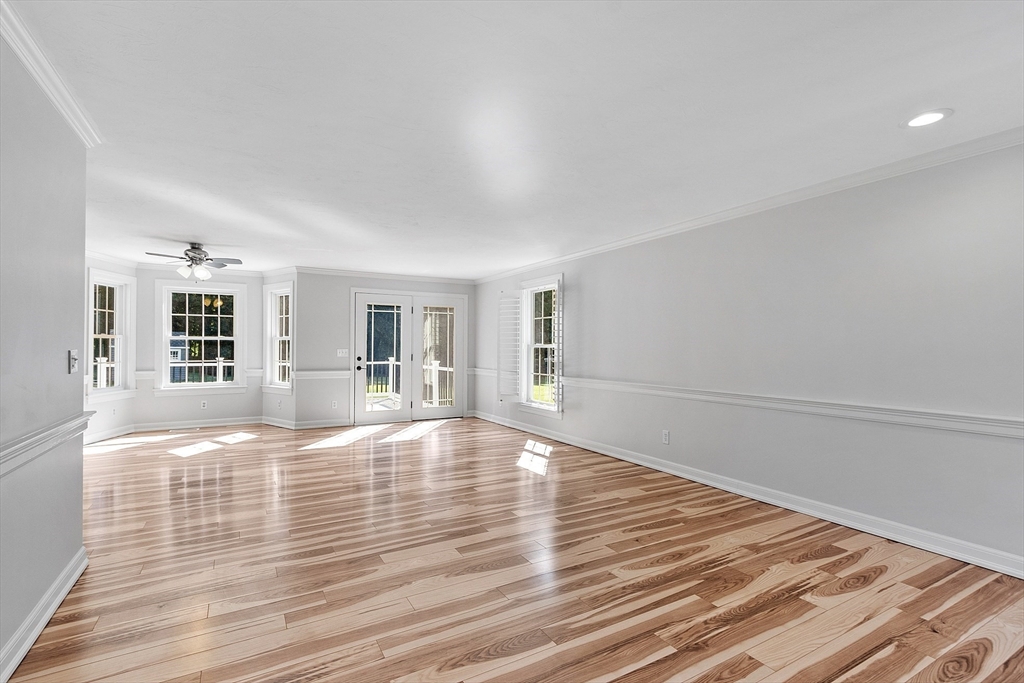 18 Sycamore Road Shrewsbury, MA 01545 - Photo 10 of 40 a view of empty room with wooden floor and fan