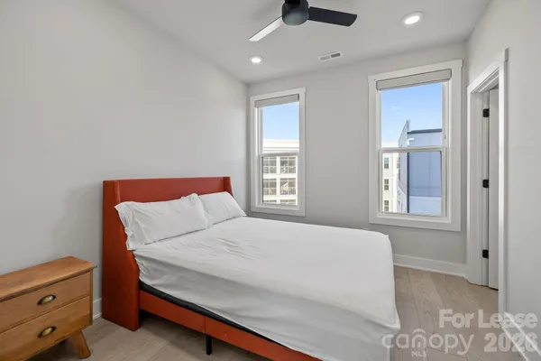 a large white bed in a small room