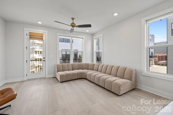 a living room with furniture and windows