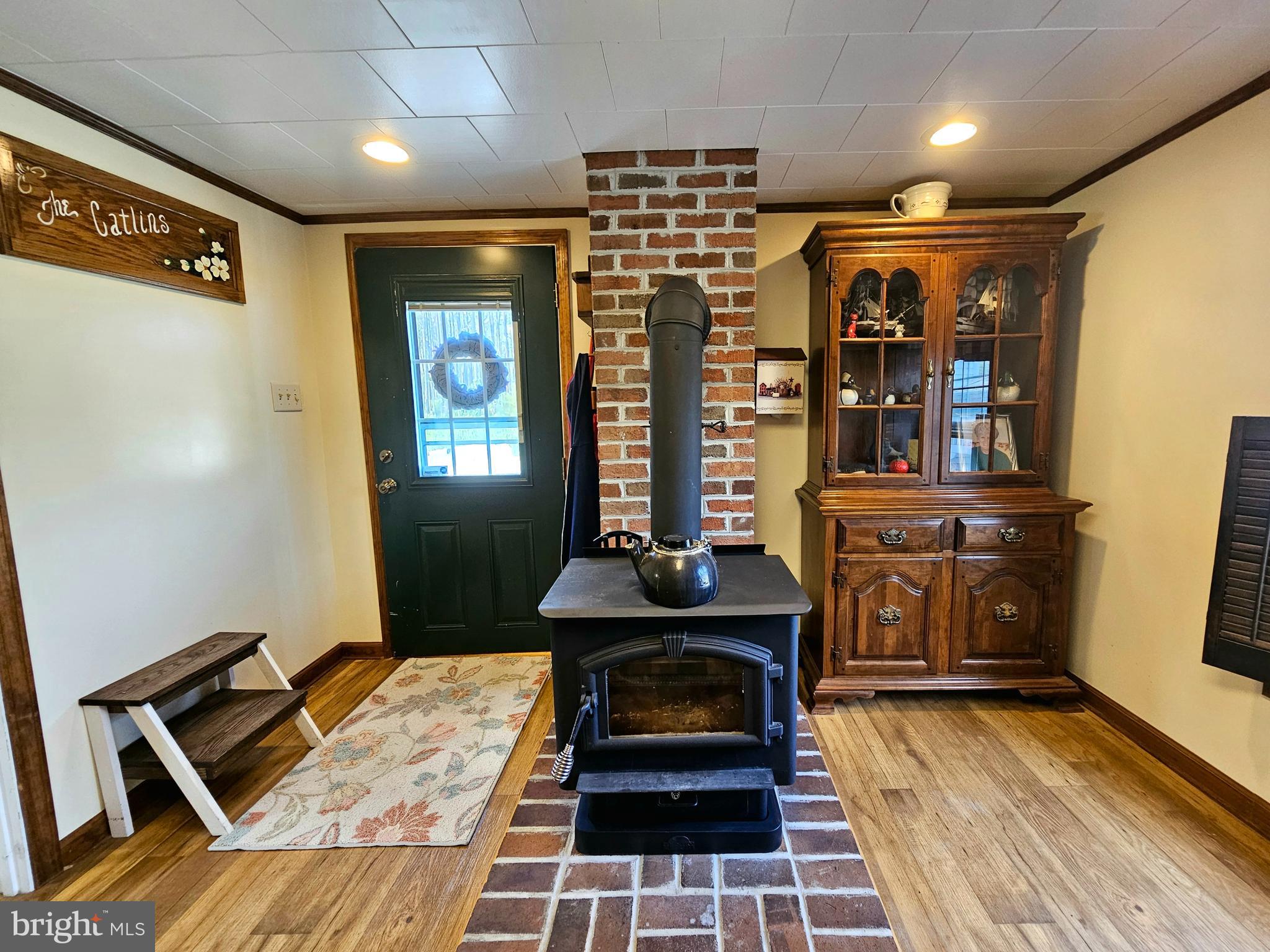 7558 Catlin Road Westover, MD 21871 - Photo 14 of 40 a living room with furniture a table and wooden floor
