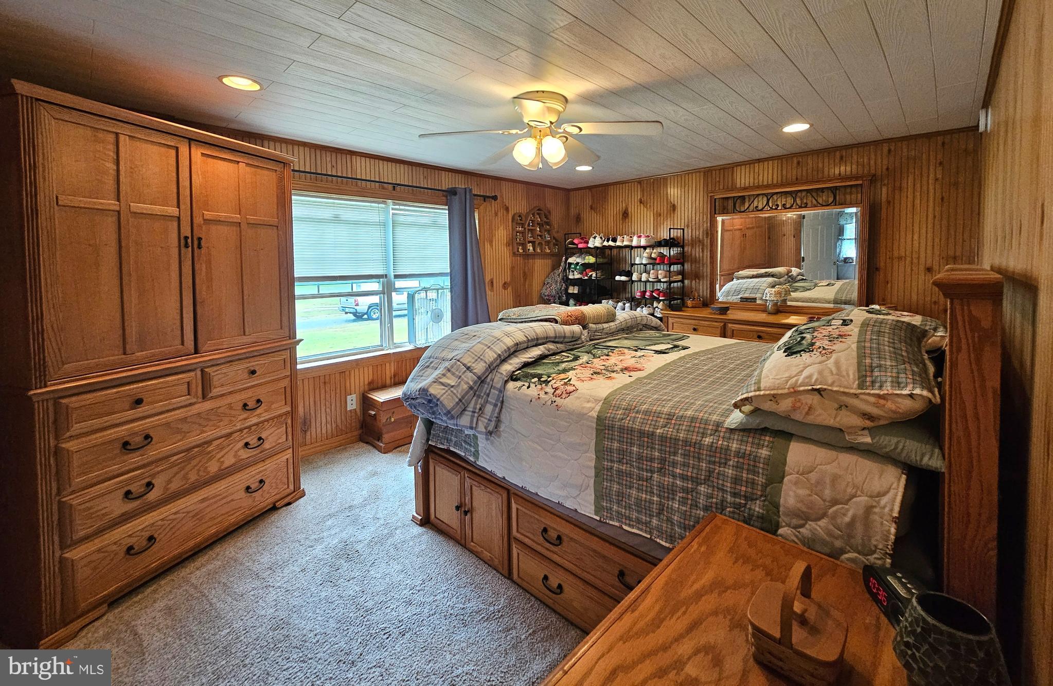 7558 Catlin Road Westover, MD 21871 - Photo 17 of 40 a bed room with a bed and a dresser