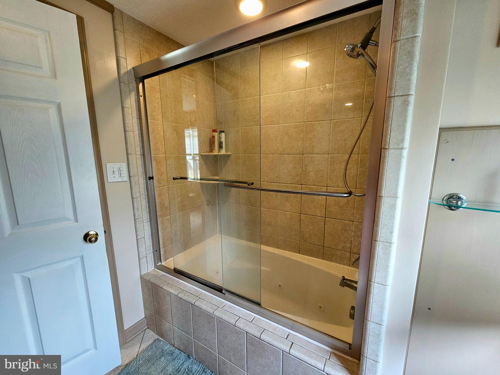 7558 Catlin Road Westover, MD 21871 - Photo 21 of 40 a bathroom with a bath tub and shower