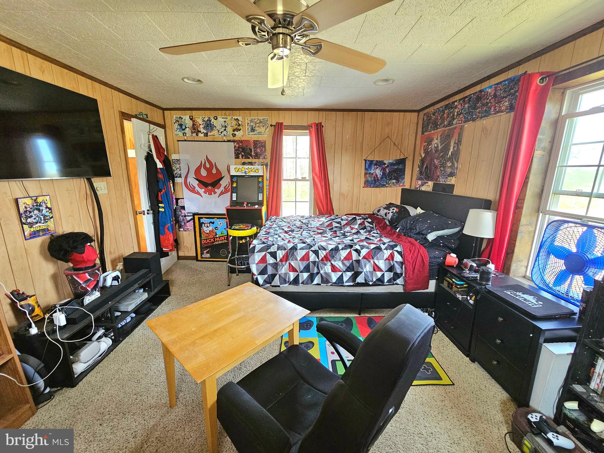 7558 Catlin Road Westover, MD 21871 - Photo 27 of 40 a living room with furniture a flat screen tv and a window