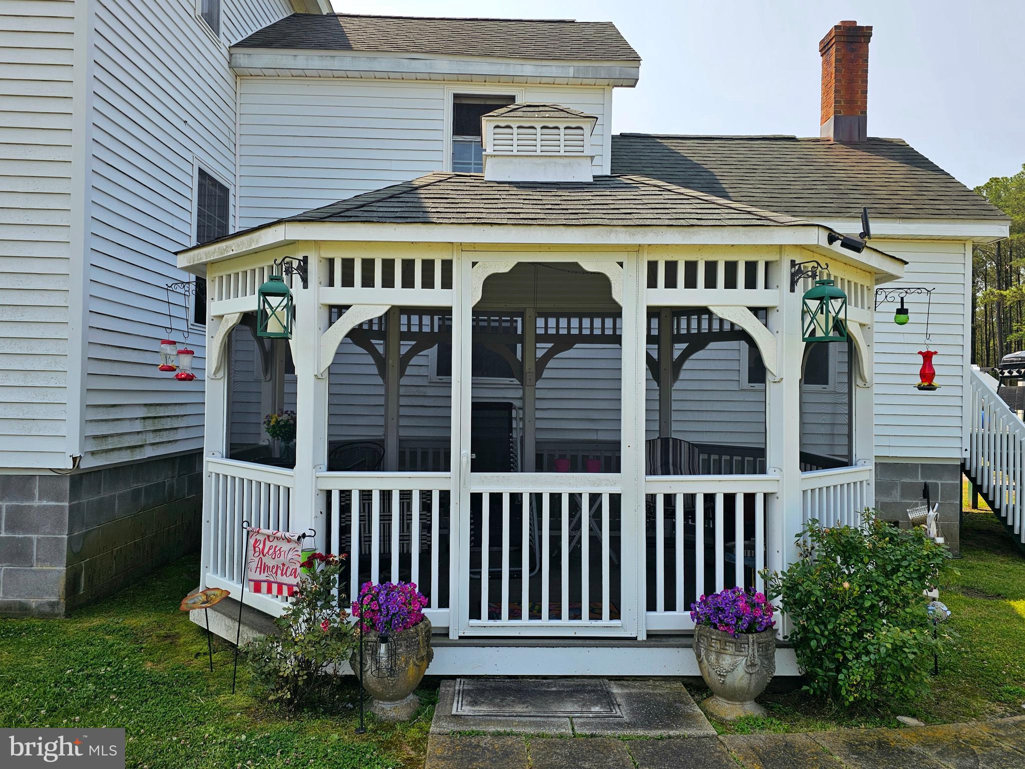 7558 Catlin Road Westover, MD 21871 - Photo 30 of 40 a view of a brick house with a small yard and plants