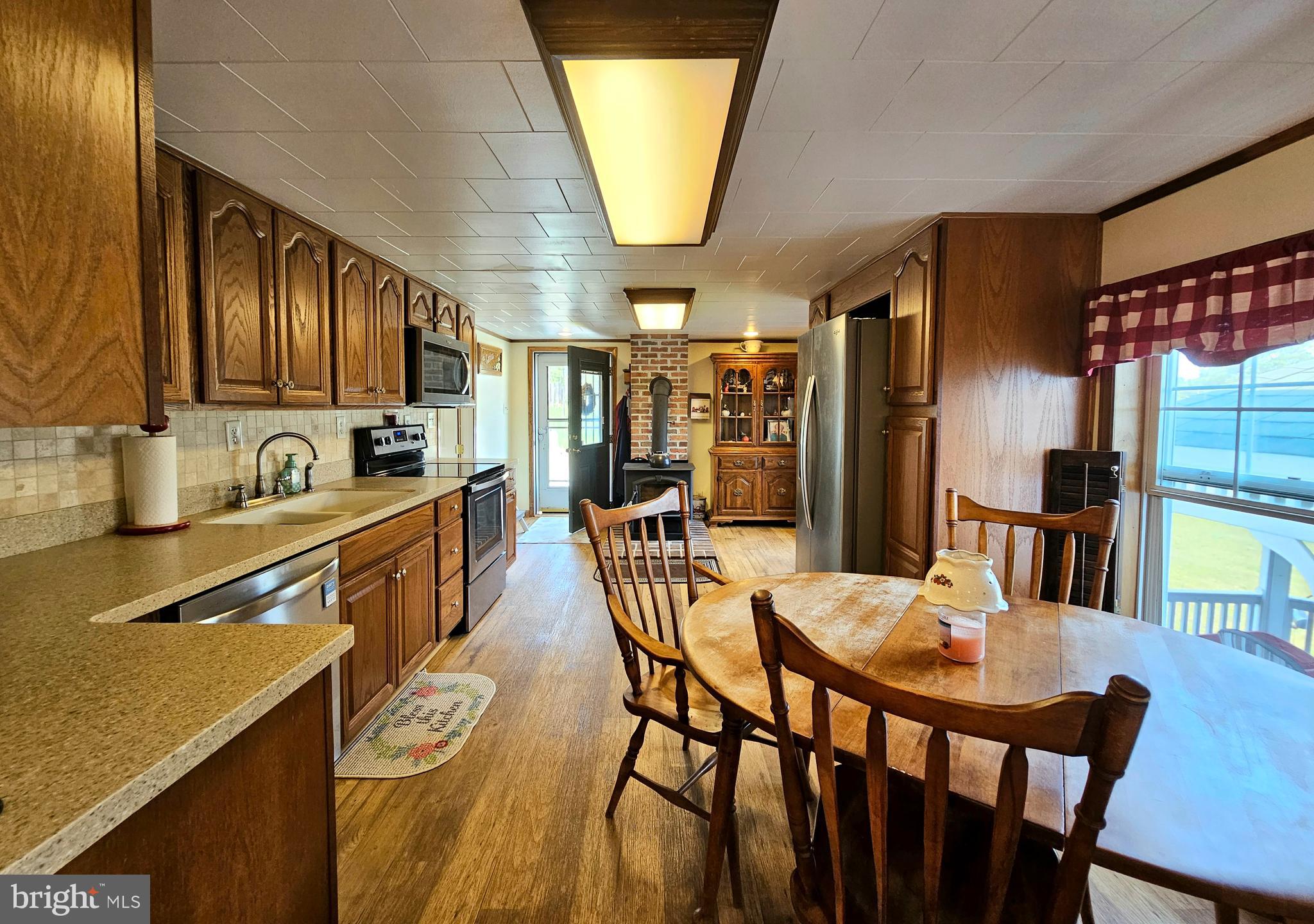 7558 Catlin Road Westover, MD 21871 - Photo 10 of 40 a view of a dining room with furniture and a kitchen