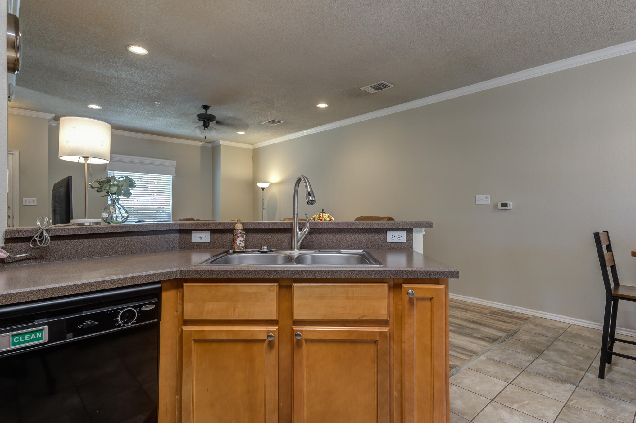 2108 Main Street, Unit 1 Lubbock, TX 79401 - Photo 13 of 29 a kitchen with kitchen island a counter top a stove and a sink