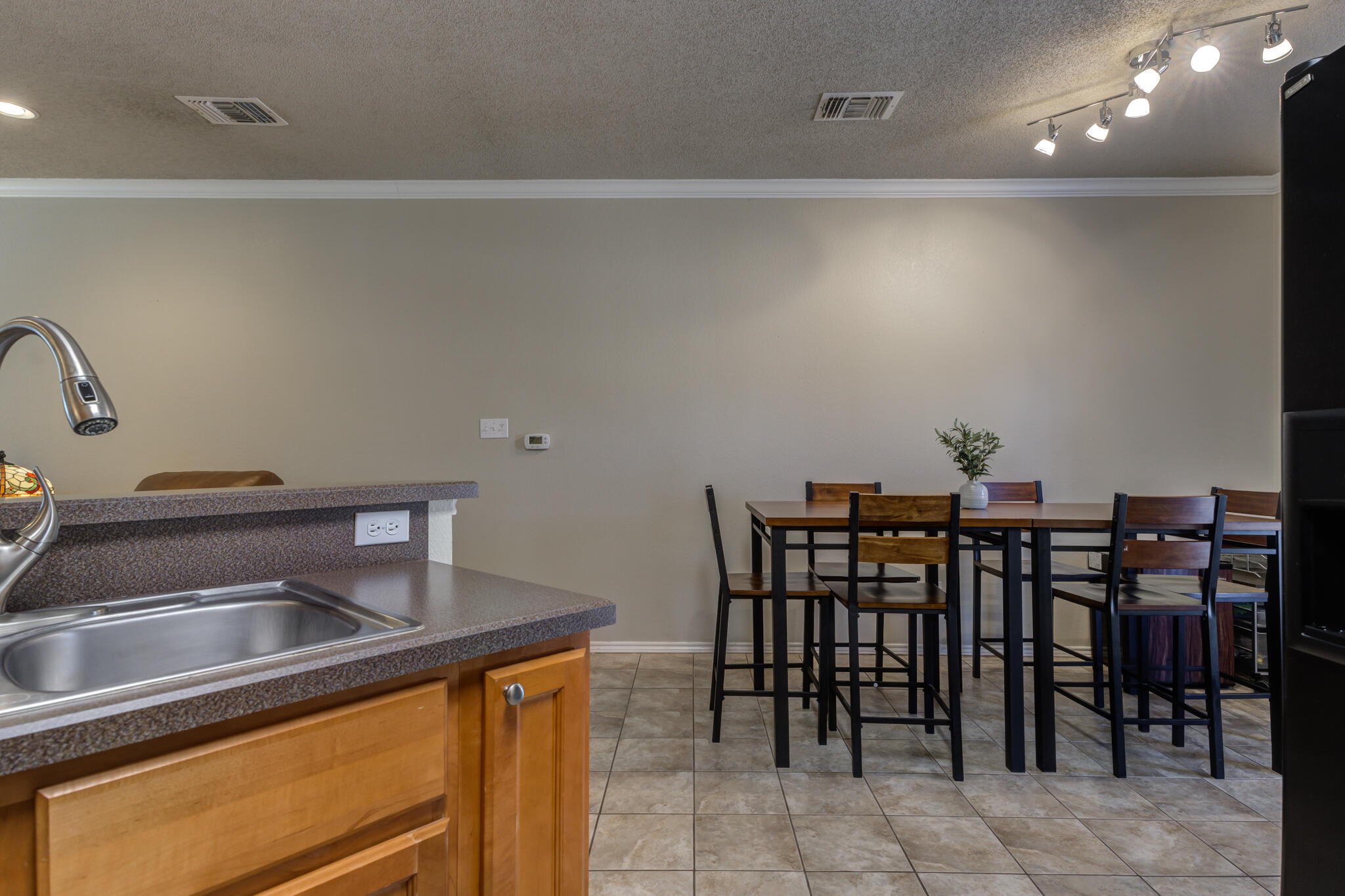 2108 Main Street, Unit 1 Lubbock, TX 79401 - Photo 14 of 29 a kitchen with a table and chairs in it
