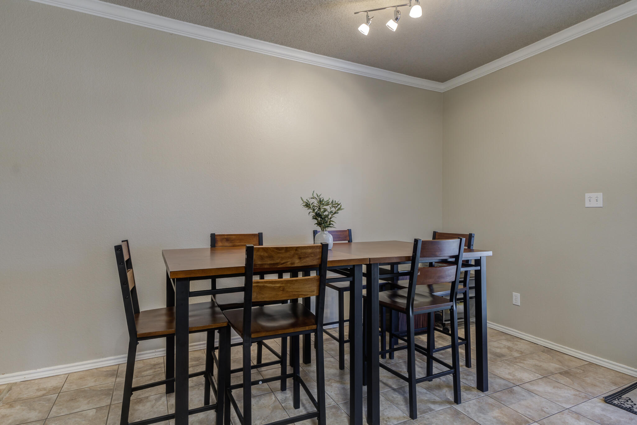 2108 Main Street, Unit 1 Lubbock, TX 79401 - Photo 15 of 29 a view of a dining room with furniture and wooden floor