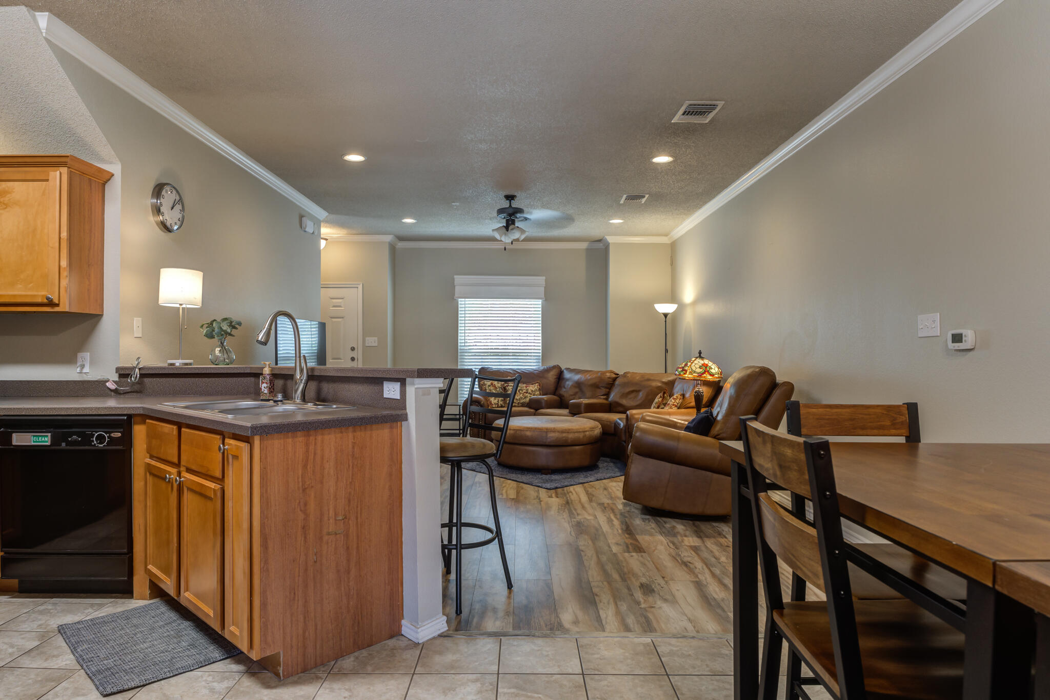 2108 Main Street, Unit 1 Lubbock, TX 79401 - Photo 18 of 29 a living room with furniture a counter top space a sink and a window
