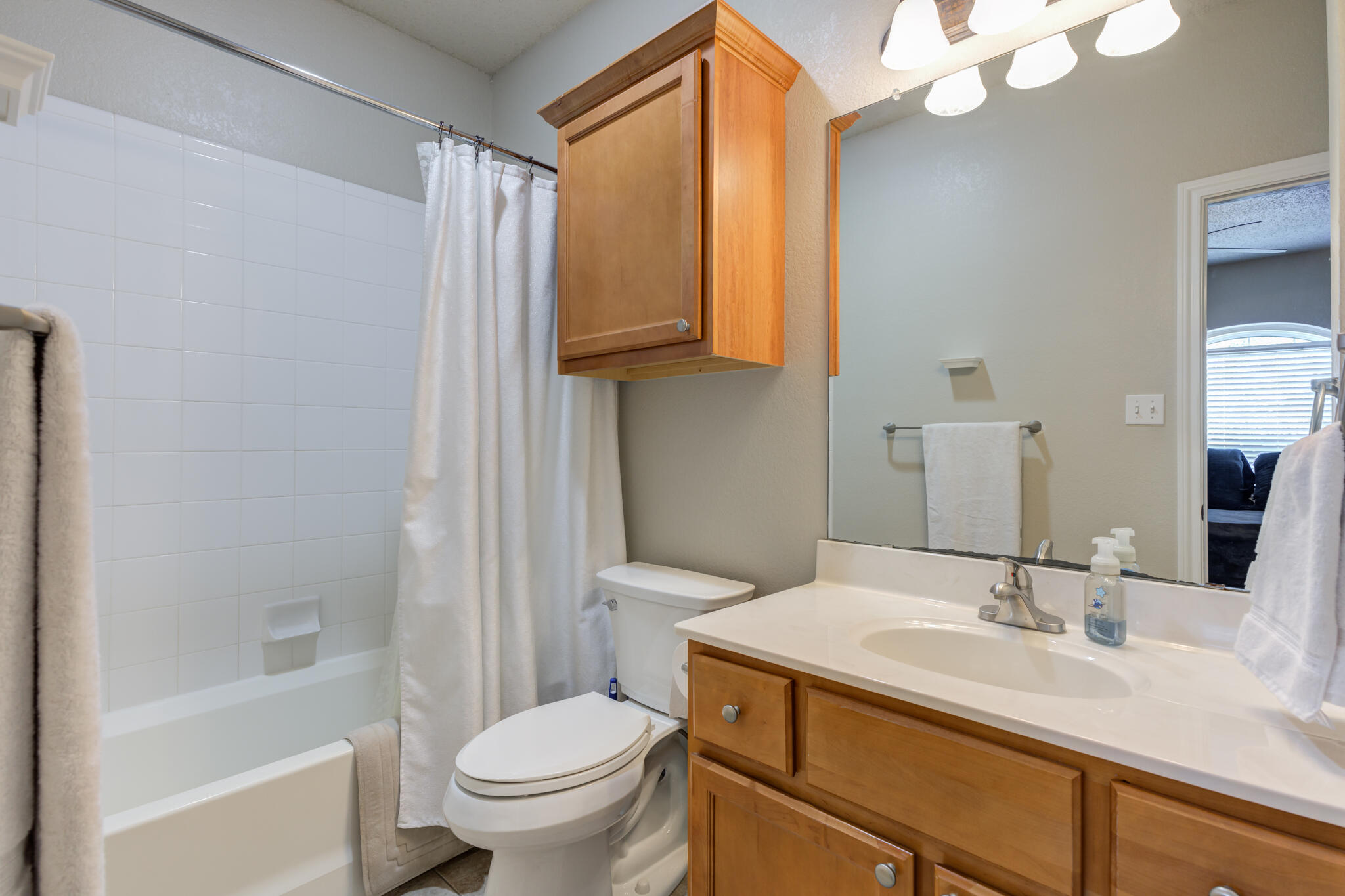 2108 Main Street, Unit 1 Lubbock, TX 79401 - Photo 22 of 29 a bathroom with a sink a toilet and shower