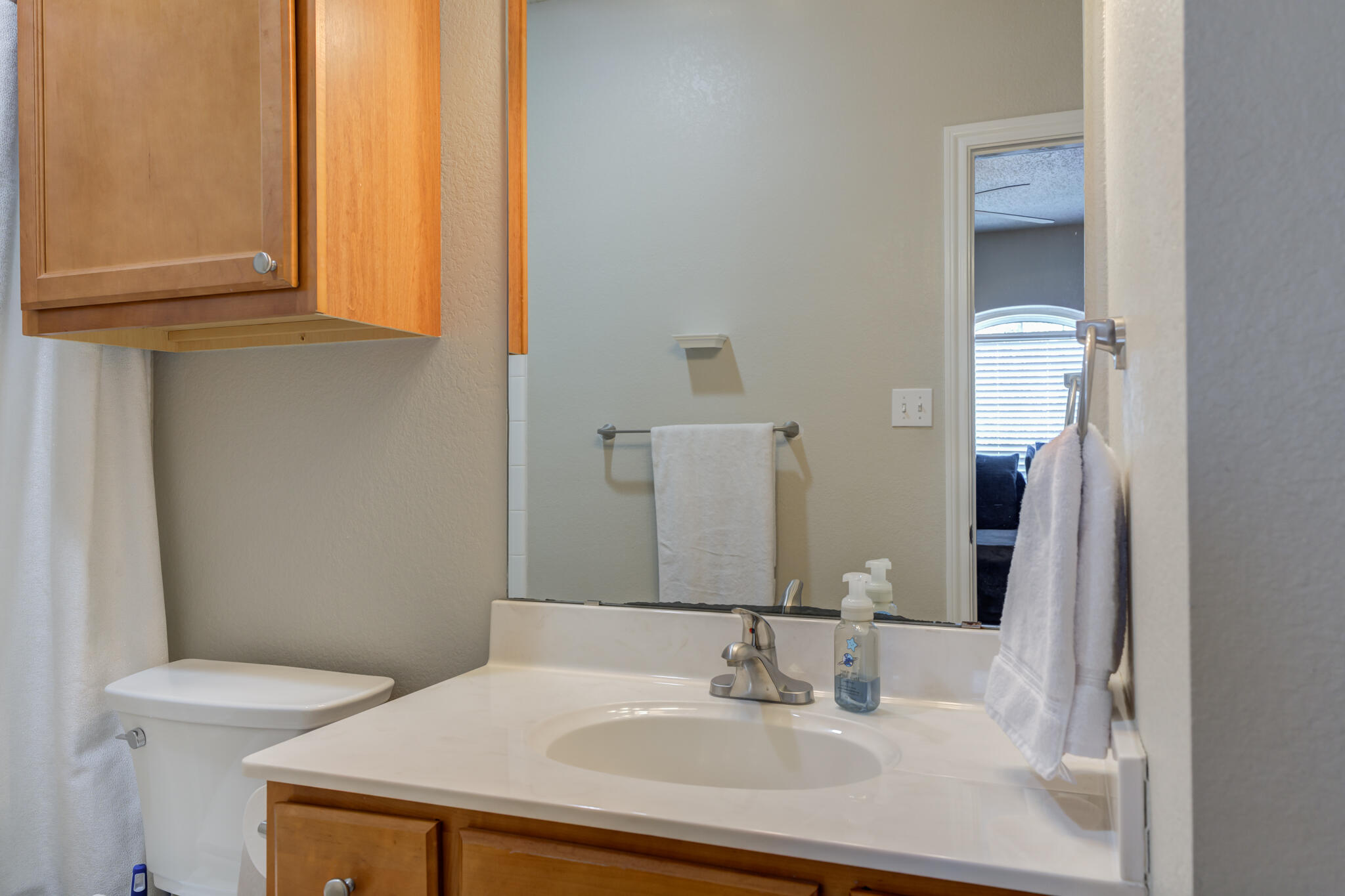 2108 Main Street, Unit 1 Lubbock, TX 79401 - Photo 23 of 29 a bathroom with a sink and a mirror