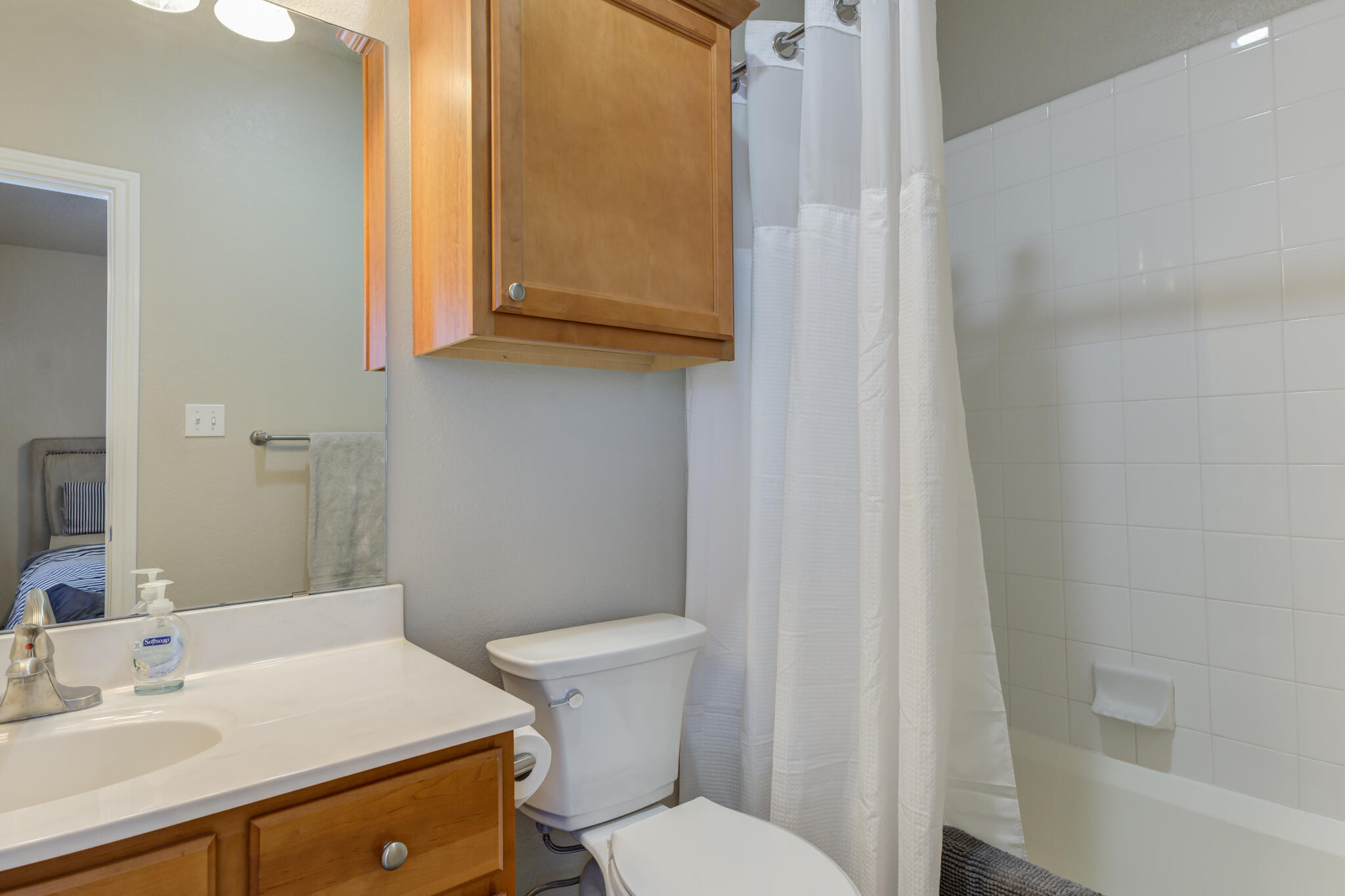2108 Main Street, Unit 1 Lubbock, TX 79401 - Photo 28 of 29 a bathroom with a sink a toilet and shower