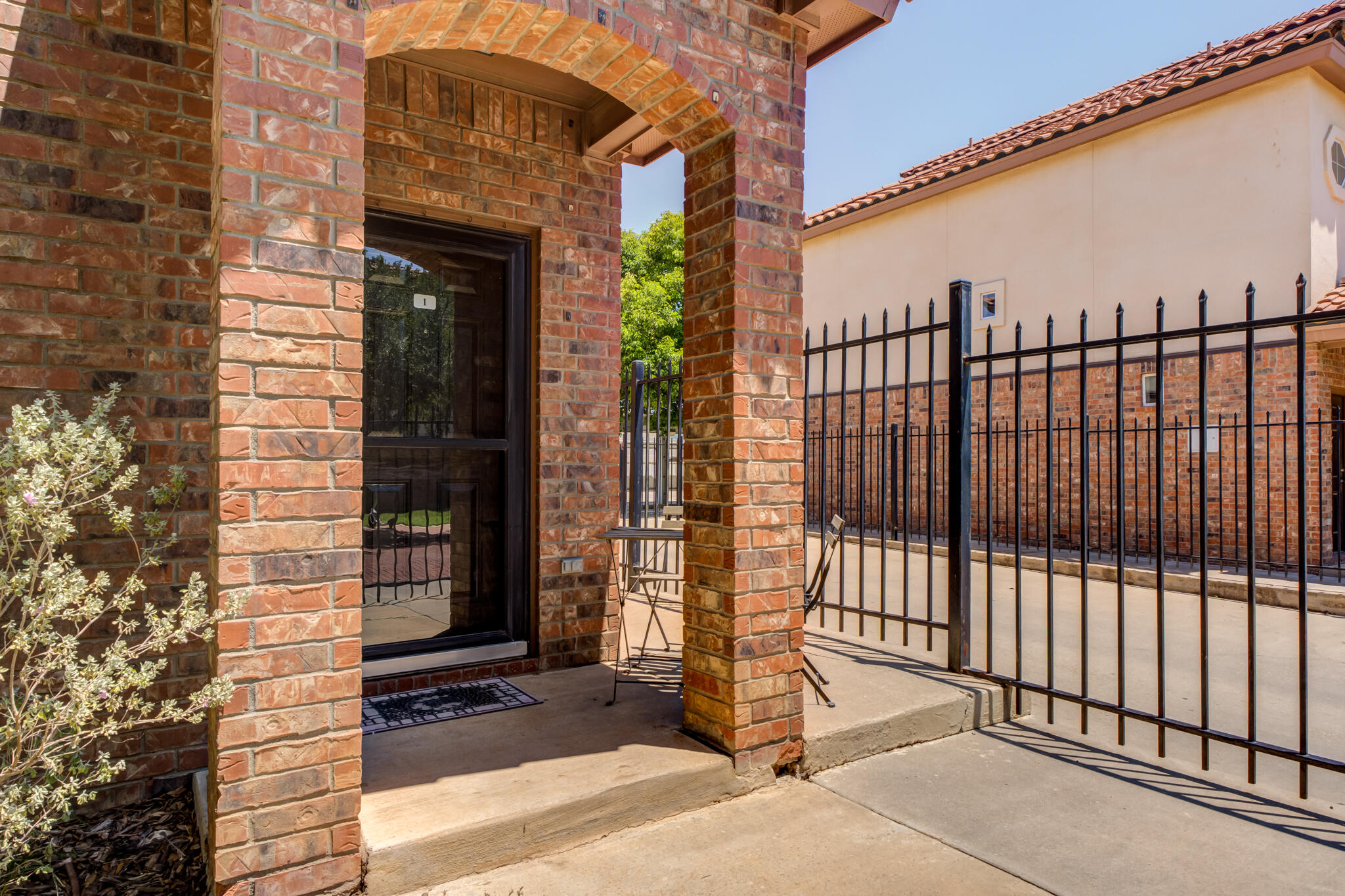 2108 Main Street, Unit 1 Lubbock, TX 79401 - Photo 4 of 29 a view of a brick wall of the building