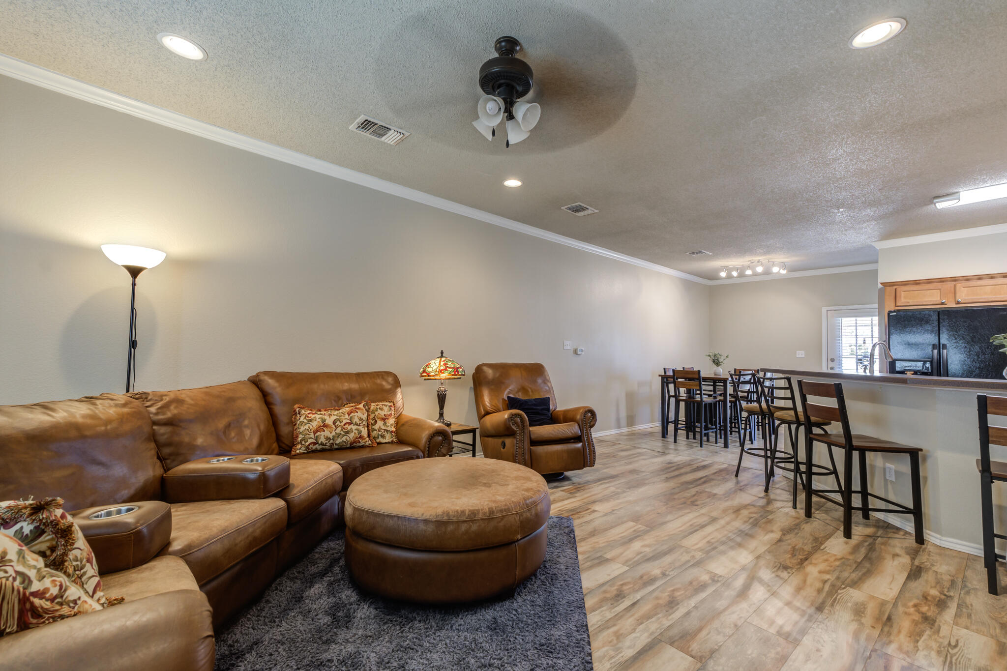 2108 Main Street, Unit 1 Lubbock, TX 79401 - Photo 5 of 29 a living room with furniture and a wooden floor