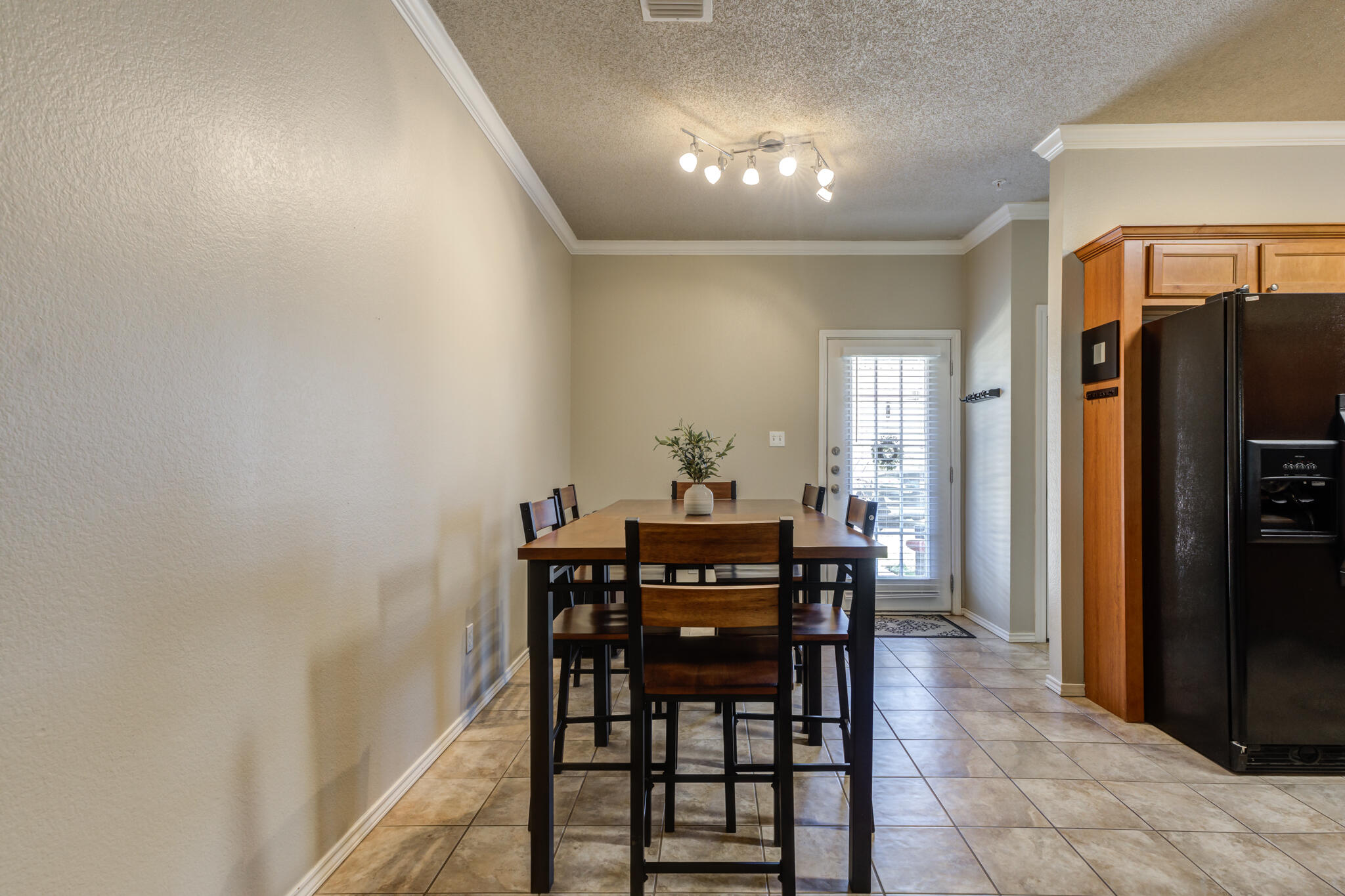 2108 Main Street, Unit 1 Lubbock, TX 79401 - Photo 9 of 29 a view of a dining room with furniture