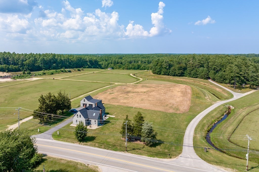 a view of a swimming pool with an outdoor seating and a garden
