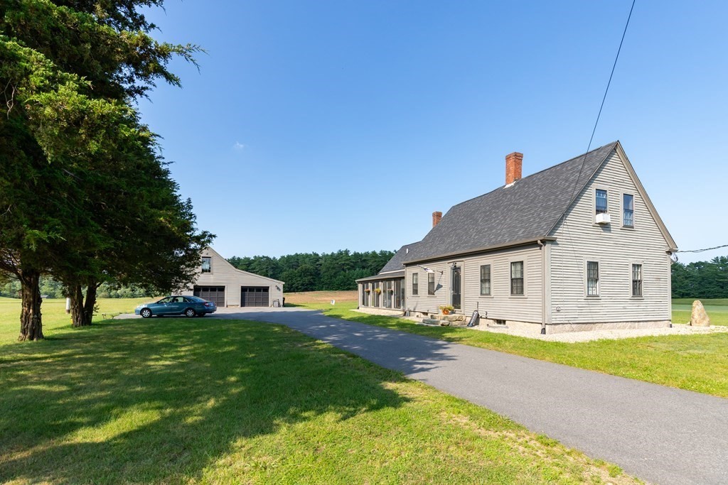 79 Wapping Road Kingston, MA 02364 - Photo 2 of 19 a view of house with garden and tall trees