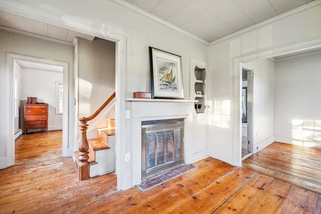 a view of an empty room with a fireplace