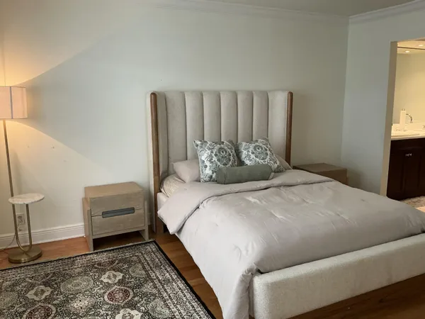 a bedroom with a bed and a couch