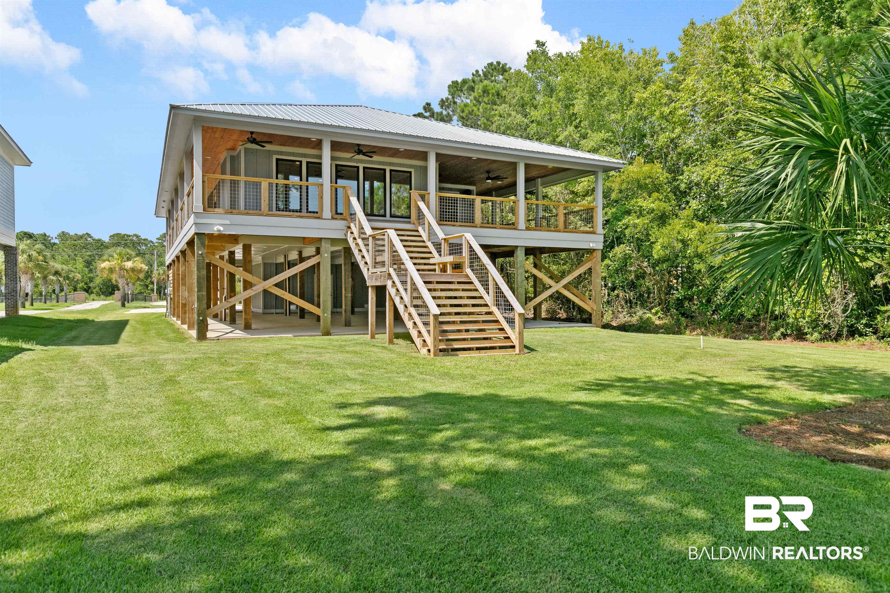 10507 County Road 1 Fairhope, AL 36532 - Photo 45 of 59 Rear view of property featuring a yard, a wooden deck, and ceiling fan