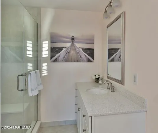 a bathroom with a sink and mirror