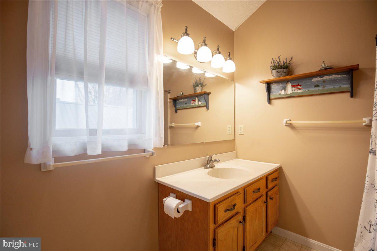 14382 Sedwick Avenue Solomons, MD 20688 - Photo 77 of 90 Full bathroom has tub-shower combo