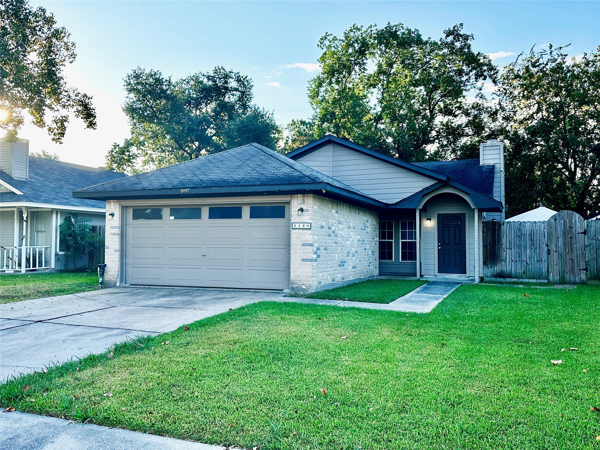 3126 Forestbrook Drive Spring, TX 77373 - Photo 1 of 18 a front view of a house with a yard and garage