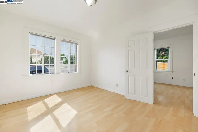 a kitchen with stainless steel appliances wooden floor sink and wooden cabinets