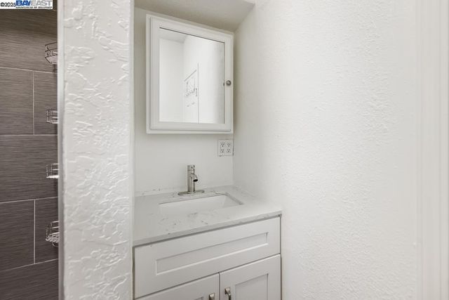 storage and utility room with wooden floor
