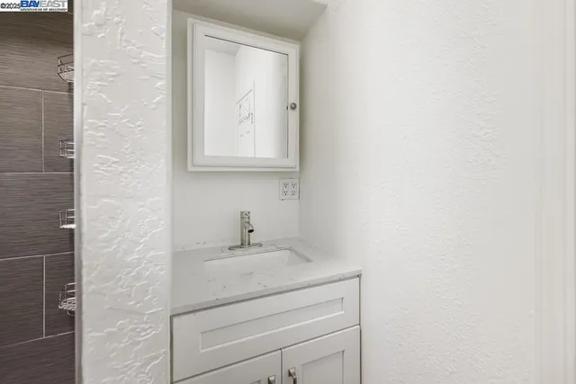 storage and utility room with wooden floor