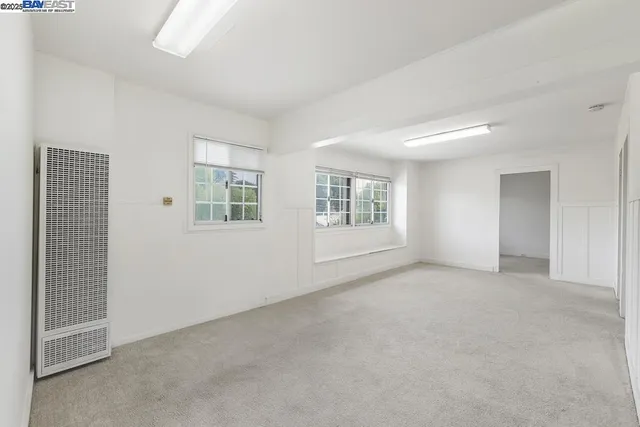 a bathroom with a tub shower and window