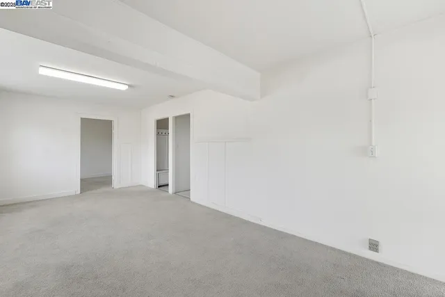 a bathroom with a white bath tub a shower and a sink