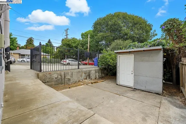 a view of a chair and tables in the patio