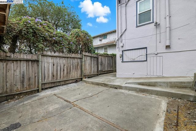 a view of a backyard of the house