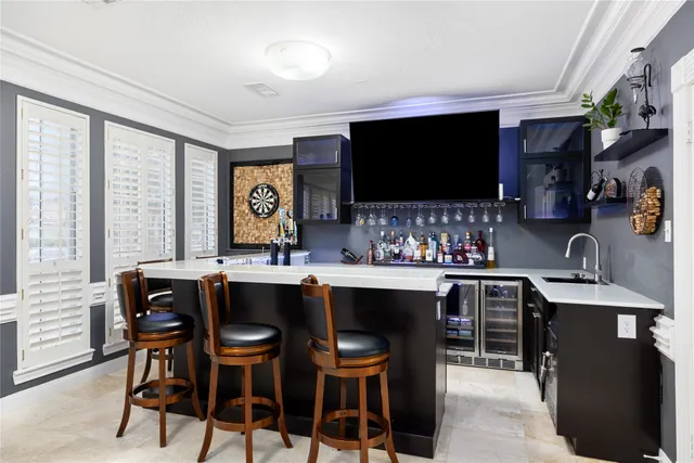 a kitchen with sink stove and cabinets