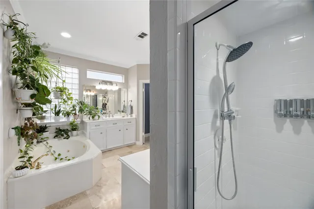 a view of an empty room with windows and stairs