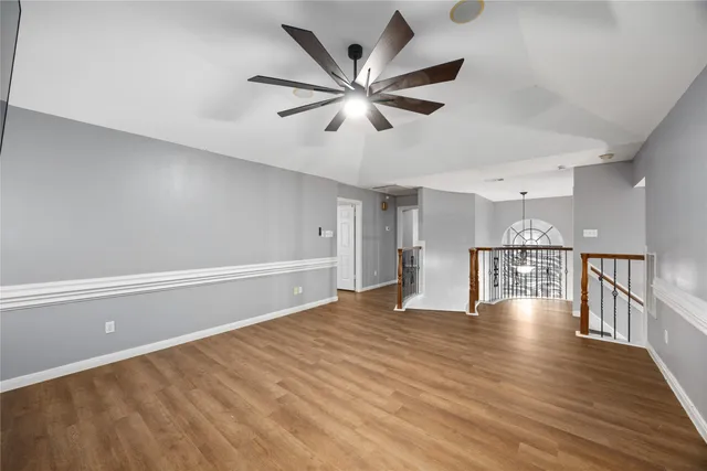 a bedroom with a bed couch and a window