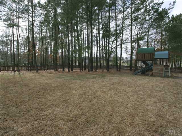1200 Verde Farm Road Raleigh, NC 27603 - Photo 24 of 25 Back yard is large and level. Fully fenced -- a great place for play or pets. Some areas of lawn plus some natural areas offering a nice mix of sun and shade.