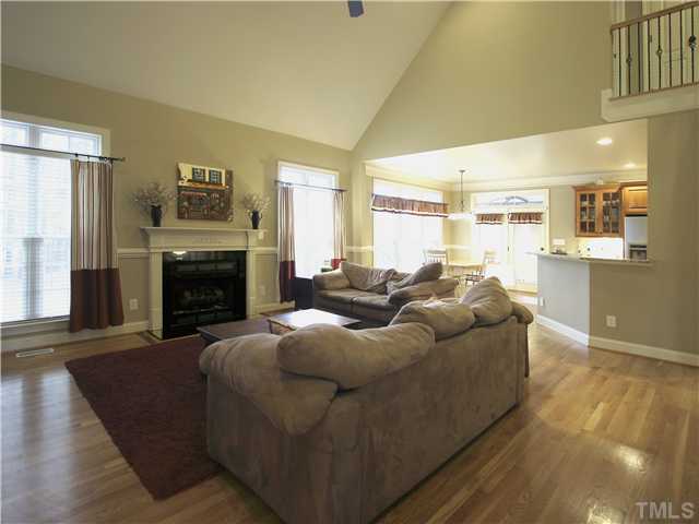 1200 Verde Farm Road Raleigh, NC 27603 - Photo 6 of 25 Family room has soaring vaulted ceiling with fan, hardwood floor. Open to breakfast area and kitchen.