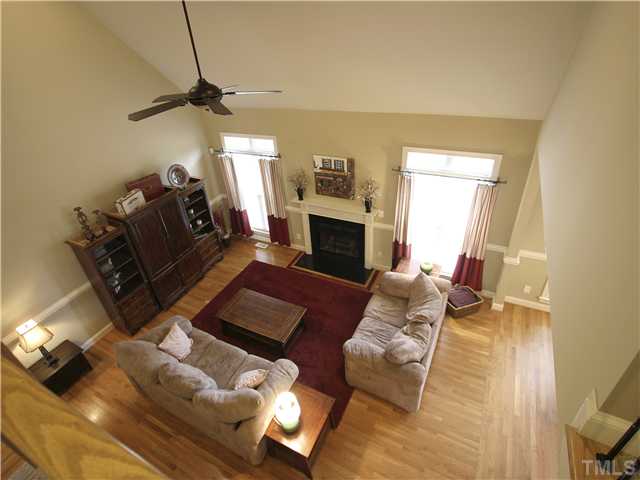 1200 Verde Farm Road Raleigh, NC 27603 - Photo 8 of 25 Family room as viewed from upstairs hallway. Note chair rail and the beautiful inlaid hardwood floor.