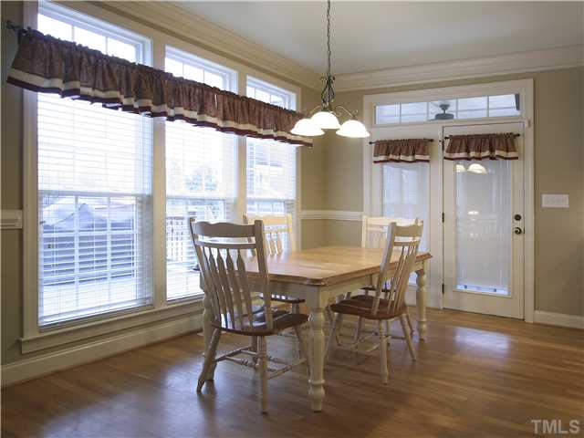 1200 Verde Farm Road Raleigh, NC 27603 - Photo 9 of 25 Savor that second cup of coffee or tea in this delightful breakfast area overlooking the deck and verdant back yard beyond. Triple window with transoms and French doors to screened porch.