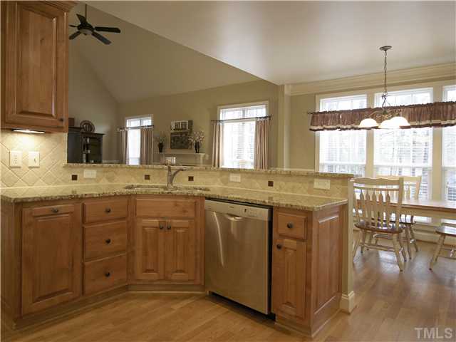 1200 Verde Farm Road Raleigh, NC 27603 - Photo 25 of 25 Wonderful open floorplan. This view from the kitchen toward the family room showcases the granite countertops and hardwood floor.